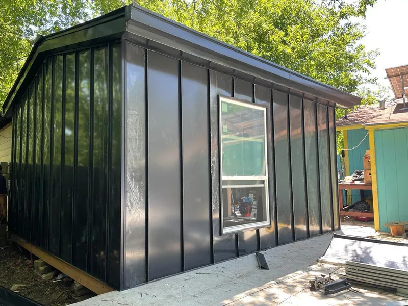 Black standing seam metal wall panels for Metal Roof Installation in Lowell